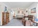 Inviting living area featuring decor, comfortable sofa, and accent chair at 6381 Lakeview Dr, Buford, GA 30518