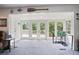 Bright living room with large windows offering a view of the deck at 6381 Lakeview Dr, Buford, GA 30518
