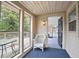 Inviting sunroom with screened windows, a comfortable seating area, and access to the outdoor deck, perfect for relaxation at 6381 Lakeview Dr, Buford, GA 30518