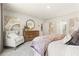 Relaxing main bedroom showcases soft carpet, elegant decor, and plenty of natural light at 8504 Polston Lot 145 Pl, Douglasville, GA 30134