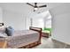 Bedroom featuring a ceiling fan, lots of light, and comfortable furniture at 2330 Wood Creek Ct, Dacula, GA 30019