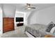Cozy bedroom featuring a ceiling fan and a wooden dresser at 2330 Wood Creek Ct, Dacula, GA 30019