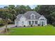 Charming, single-story home with a manicured lawn and white painted brick at 2330 Wood Creek Ct, Dacula, GA 30019