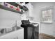 Functional laundry room featuring modern appliances and ample counter space at 2330 Wood Creek Ct, Dacula, GA 30019