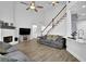 Open-concept living room with vaulted ceilings and brick fireplace at 2330 Wood Creek Ct, Dacula, GA 30019