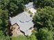Secluded estate home with a grey roof surrounded by lush trees offering privacy at 3978 Devonshire Dr, Marietta, GA 30066