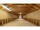 Large unfinished attic space with exposed wood beams, pegboard, and ample storage potential at 3978 Devonshire Dr, Marietta, GA 30066