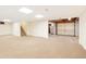 Unfinished basement with stairs, white walls and door to garage at 3978 Devonshire Dr, Marietta, GA 30066