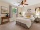 Bedroom featuring neutral walls, a large bed, ceiling fan and lots of natural light at 3978 Devonshire Dr, Marietta, GA 30066