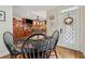 Cozy breakfast nook adjacent to kitchen with a stained glass window and table for four at 3978 Devonshire Dr, Marietta, GA 30066