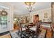 Elegant dining room featuring a chandelier, hardwood floors, and access to a porch with natural light at 3978 Devonshire Dr, Marietta, GA 30066