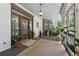 Charming front porch with stained glass door, overhead lighting, and stylish seating area at 3978 Devonshire Dr, Marietta, GA 30066