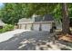 Spacious detached three-car garage with a long driveway and ample parking at 3978 Devonshire Dr, Marietta, GA 30066