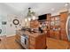 Open kitchen design with center island, granite counters, stainless appliances, and custom wood cabinets at 3978 Devonshire Dr, Marietta, GA 30066