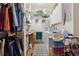 Well-organized laundry room with shelving, sink, washer, dryer, and storage at 3978 Devonshire Dr, Marietta, GA 30066
