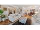 Open-concept living room featuring hardwood floors and easy access to the dining room and staircase at 3978 Devonshire Dr, Marietta, GA 30066
