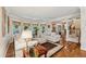Bright living room with bay window, hardwood floors, neutral colors, and crown molding at 3978 Devonshire Dr, Marietta, GA 30066