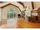 Inviting living room with vaulted ceilings, large windows, a fireplace, and a built-in bar at 3978 Devonshire Dr, Marietta, GA 30066