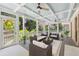 Cozy screened porch with ceiling fans, and comfortable seating at 3978 Devonshire Dr, Marietta, GA 30066