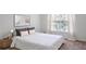 Bedroom with large window and neutral decor at 200 Renaissance Ne Pkwy # 219, Atlanta, GA 30308
