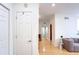 Hallway features hardwood floors that lead to a living room area at 200 Renaissance Ne Pkwy # 219, Atlanta, GA 30308