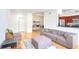 Cozy living room with hardwood floors and an open view to the kitchen at 200 Renaissance Ne Pkwy # 219, Atlanta, GA 30308