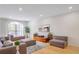 Spacious living room with hardwood floors, neutral decor, and a large window at 200 Renaissance Ne Pkwy # 219, Atlanta, GA 30308