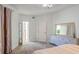 Well-lit bedroom with a dresser, carpet and ensuite bath at 200 Renaissance Ne Pkwy # 219, Atlanta, GA 30308