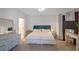 Elegant main bedroom with a comfortable bed, dresser, and neutral decor at 200 Renaissance Ne Pkwy # 219, Atlanta, GA 30308