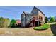 Backyard with large deck and stairway from the second story of the house to the lawn at 222 Chadmore Ln, Tyrone, GA 30290