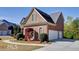 Brick home with 2-car garage and manicured landscaping at 222 Chadmore Ln, Tyrone, GA 30290