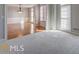 Carpeted room with white trim and large windows at 222 Chadmore Ln, Tyrone, GA 30290