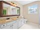 Bright bathroom features a large mirror, double sinks, and natural light at 2431 Rosedale Creek Dr, Snellville, GA 30078