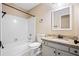 Bathroom includes a shower/tub, vanity with granite countertops, and updated fixtures at 2431 Rosedale Creek Dr, Snellville, GA 30078