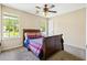 Bedroom featuring neutral walls, carpet flooring, and natural light at 2431 Rosedale Creek Dr, Snellville, GA 30078