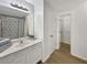 Clean bathroom features a spacious vanity, large mirror, and separate closet area at 2964 Greyhawk Ln # 160, Cumming, GA 30040