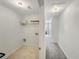 Hallway with a laundry area and carpeted floor that leads to other rooms at 2964 Greyhawk Ln # 160, Cumming, GA 30040