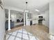 Open-concept kitchen and living area filled with natural light and stylish decor at 2964 Greyhawk Ln # 160, Cumming, GA 30040