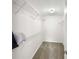 Spacious walk-in closet features white wire shelving and neutral carpet at 2964 Greyhawk Ln # 160, Cumming, GA 30040