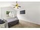Cozy bedroom featuring a ceiling fan, natural light, and neutral tones at 2964 Greyhawk Ln, Cumming, GA 30040