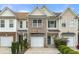 Charming townhome with a well-maintained exterior and attached garage at 2964 Greyhawk Ln, Cumming, GA 30040