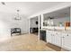 Bright kitchen with white cabinets, modern appliances, and an open layout at 2964 Greyhawk Ln, Cumming, GA 30040