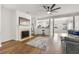 Inviting living room featuring a fireplace, ceiling fan, and open floor plan at 2964 Greyhawk Ln, Cumming, GA 30040