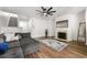Bright living room boasts a fireplace and hardwood floors at 2964 Greyhawk Ln, Cumming, GA 30040