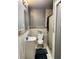 A well lit bathroom with a clean toilet and sink along with tile accents at 3233 Rockmill Dr, Ellenwood, GA 30294