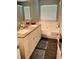 Main bathroom features double sinks, granite countertops, and a large tub at 3233 Rockmill Dr, Ellenwood, GA 30294