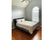 Bedroom with hardwood floors, natural light, and a large bed at 3233 Rockmill Dr, Ellenwood, GA 30294
