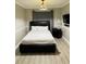 Bedroom with a modern bed frame and matching accents at 3233 Rockmill Dr, Ellenwood, GA 30294