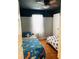 Colorful bedroom with twin beds, ceiling fan and wood floors at 3233 Rockmill Dr, Ellenwood, GA 30294