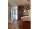 View of the kitchen with tile floors, wood cabinets, and a refrigerator in the background at 3233 Rockmill Dr, Ellenwood, GA 30294